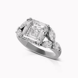 Cut Cornered Step Cut Diamond Solitaire accented with Marquise Cut Diamond Shoulders